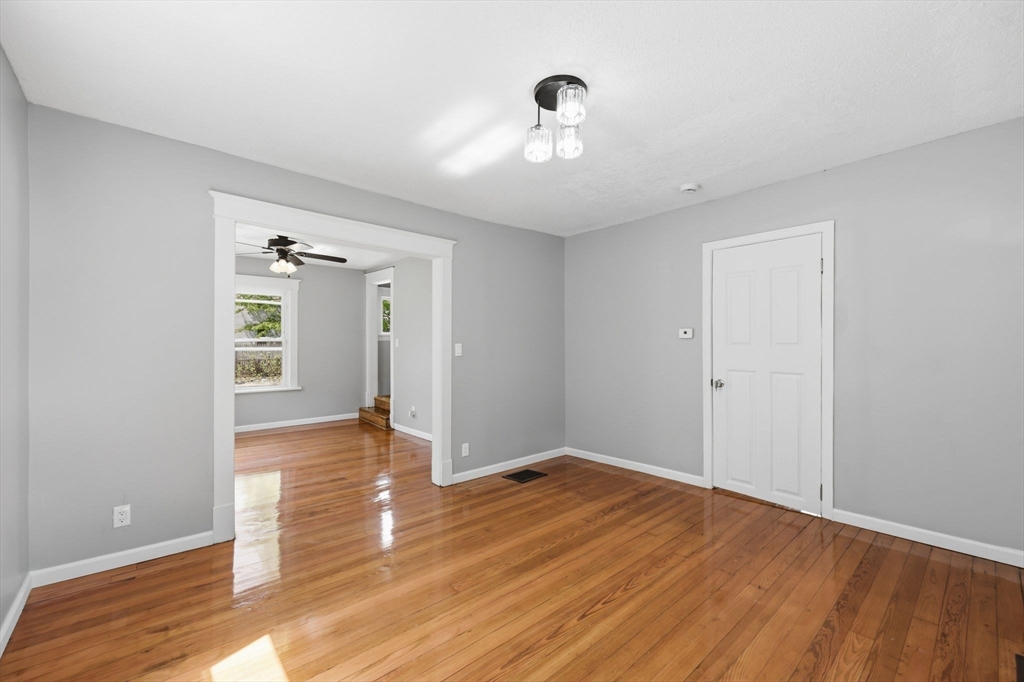 62 Kenyon Street Springfield, MA 01109 - Photo 6 of 26 wooden floor in an empty room with a window