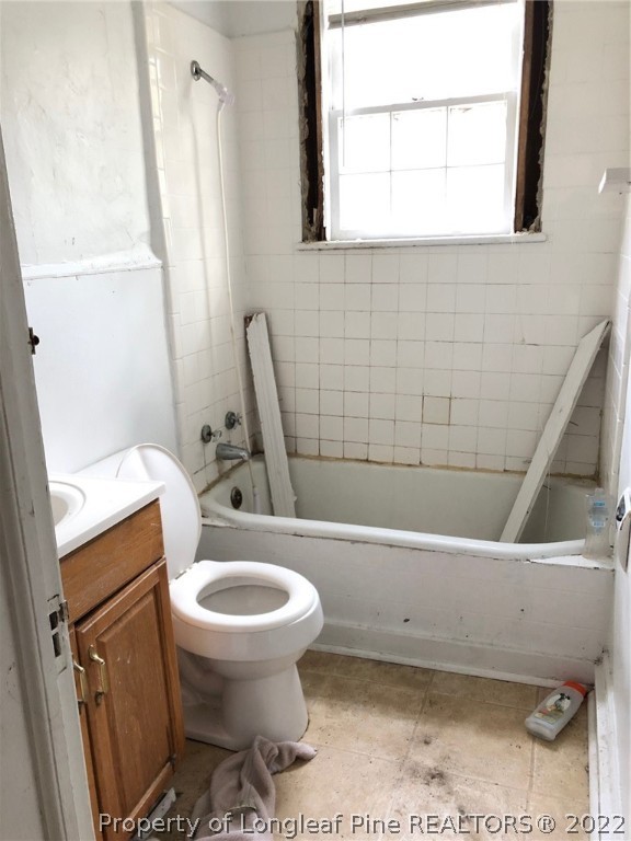 700 Ann Street Rockingham, NC 28379 - Photo 17 of 19 a bathroom with a sink a toilet and a bathtub