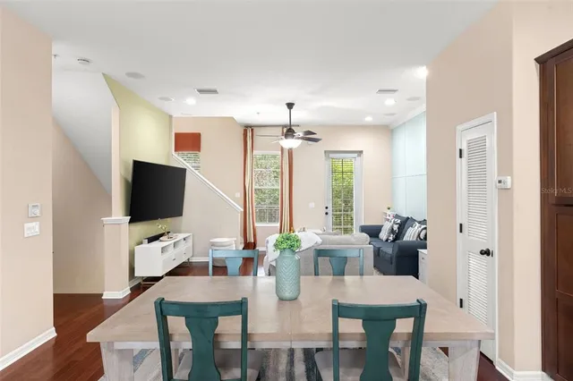 a view of a dining room with furniture and wooden floor