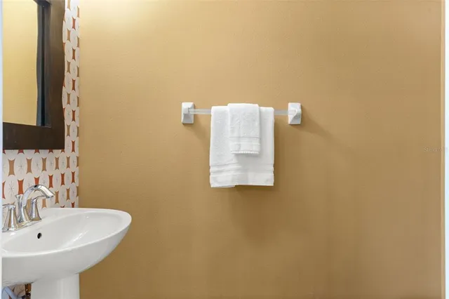 a bathroom with a sink and a mirror