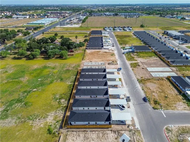 an aerial view of residential houses with swimming pool