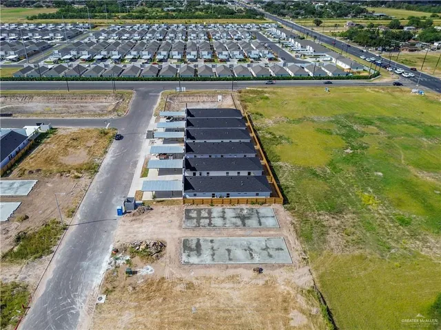 a view of swimming pool with outdoor seating and yard