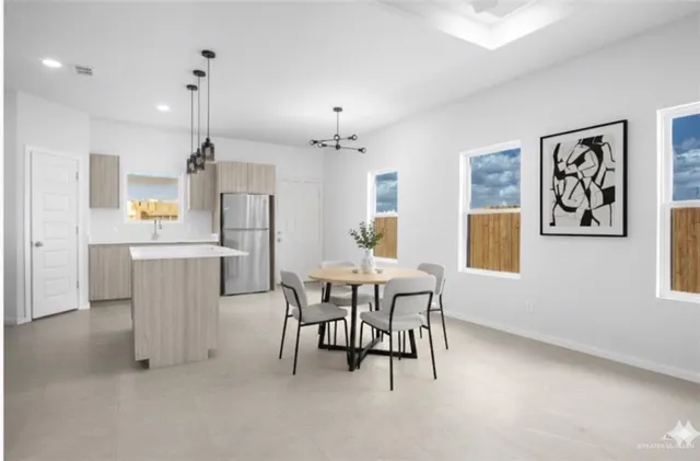 a view of a dining room with furniture and window