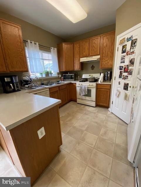 360 Snyder Lane Culpeper, VA 22701 - Photo 4 of 8 a kitchen with stainless steel appliances a stove a sink a microwave and cabinets