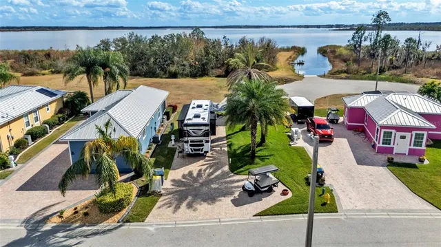 an outdoor space with seating area and trees in the background