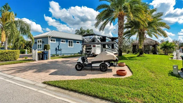 a view of a house with backyard and swimming pool