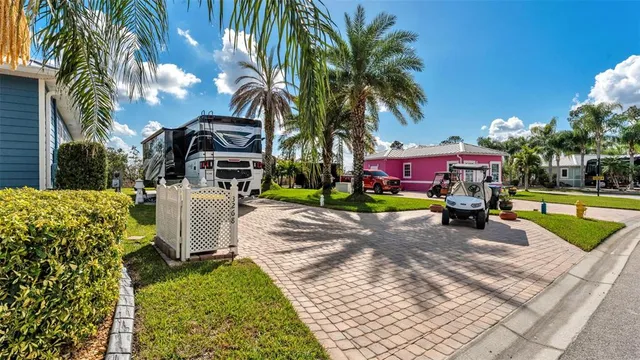 a view of a backyard with plants and swimming pool