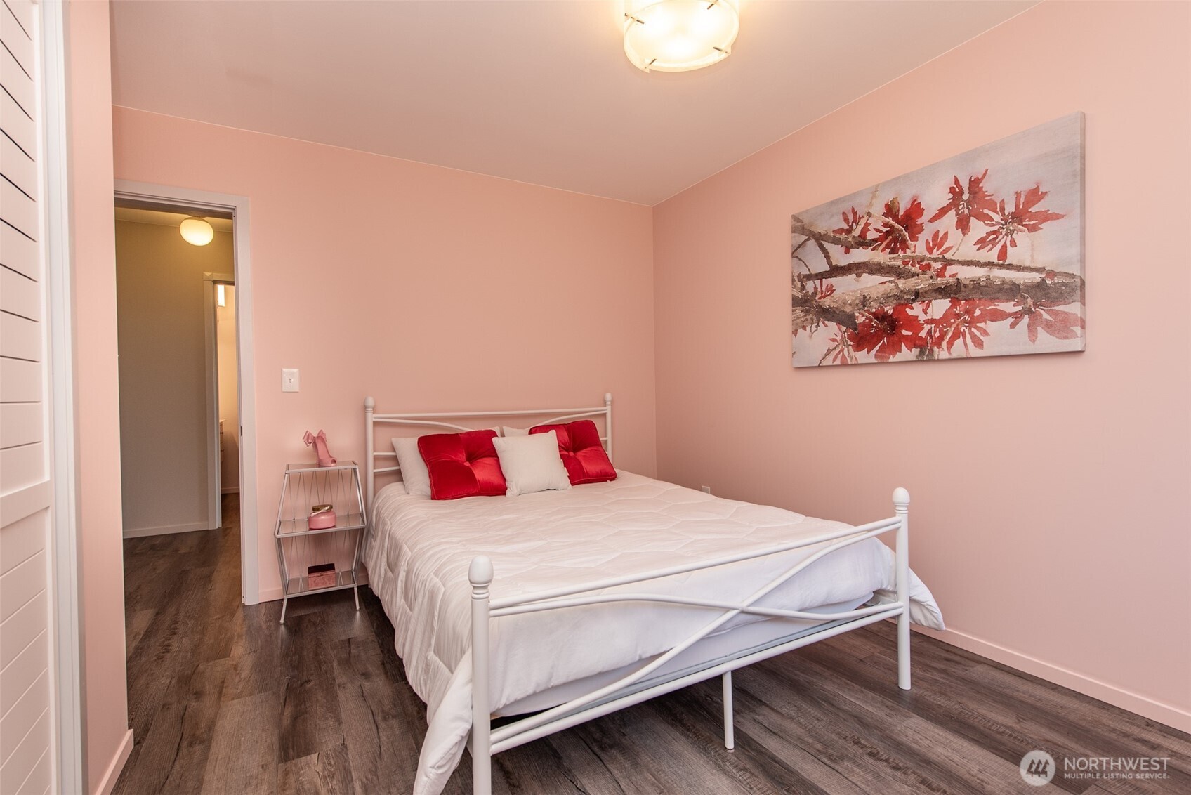 681 Bachelor Road Sequim, WA 98382 - Photo 23 of 39 a bedroom with a bed and a painting on the wall