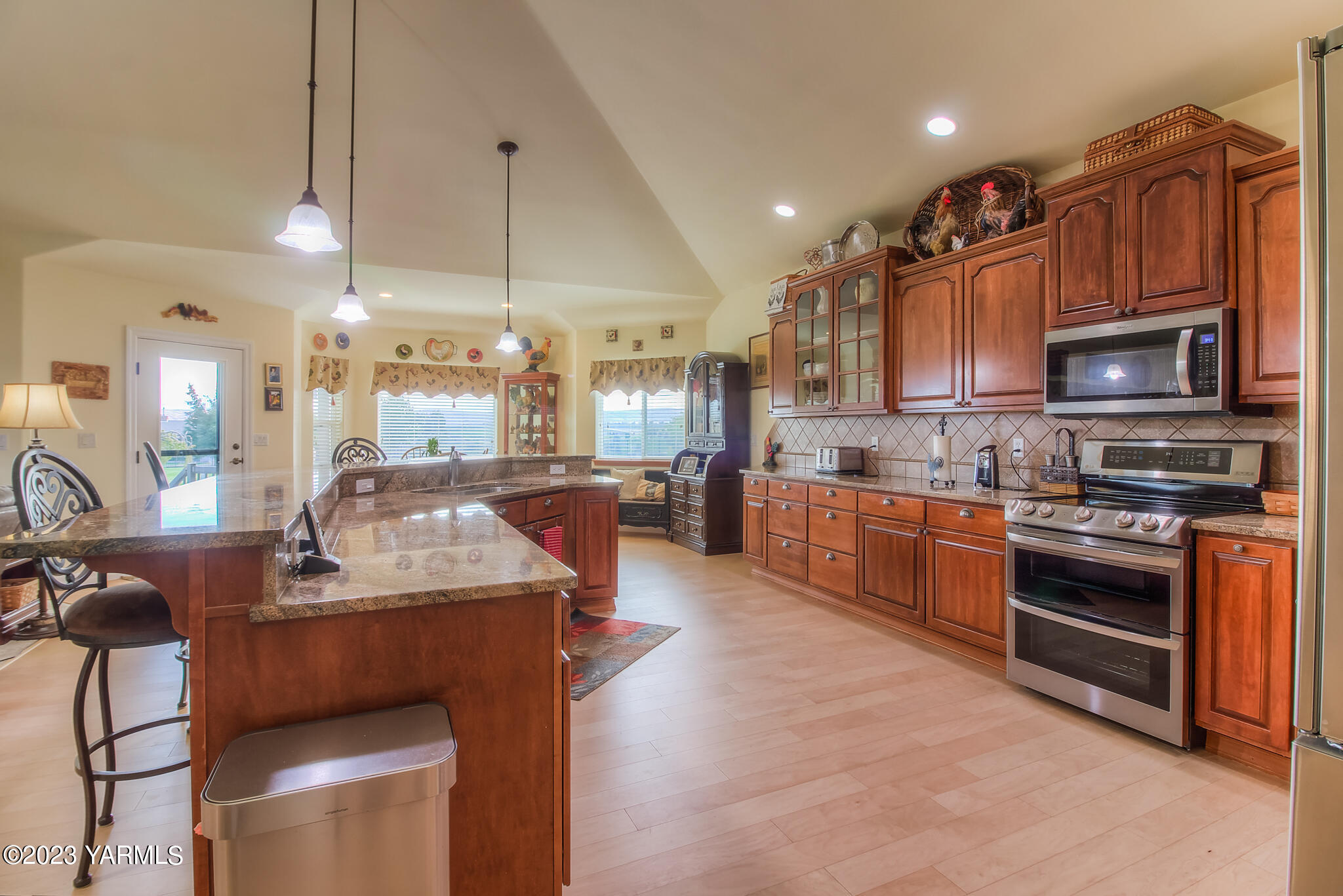 654 South Friedline Road Yakima, WA 98908 - Photo 8 of 34 a kitchen with stainless steel appliances granite countertop a sink a stove top oven a counter space and cabinets