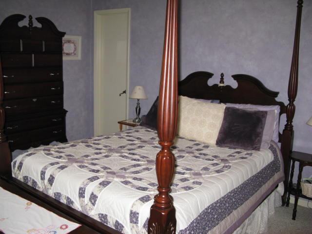 1383 Johnson School Road Thaxton, VA 24174 - Photo 15 of 22 a bedroom with a bed and dresser with mirror