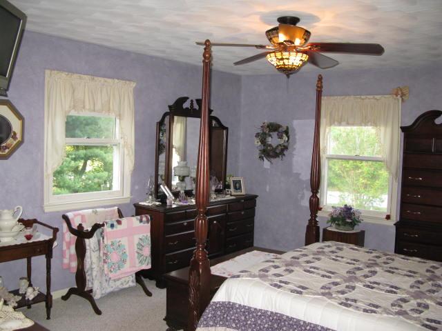 1383 Johnson School Road Thaxton, VA 24174 - Photo 16 of 22 a bedroom with a bed dresser and a window