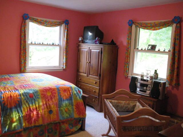 1383 Johnson School Road Thaxton, VA 24174 - Photo 19 of 22 a bedroom with a bed and wooden floor