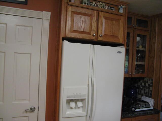 1383 Johnson School Road Thaxton, VA 24174 - Photo 6 of 22 a kitchen with granite countertop white cabinets and stainless steel appliances
