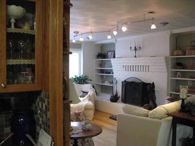 1383 Johnson School Road Thaxton, VA 24174 - Photo 7 of 22 a living room with furniture a window and a fireplace