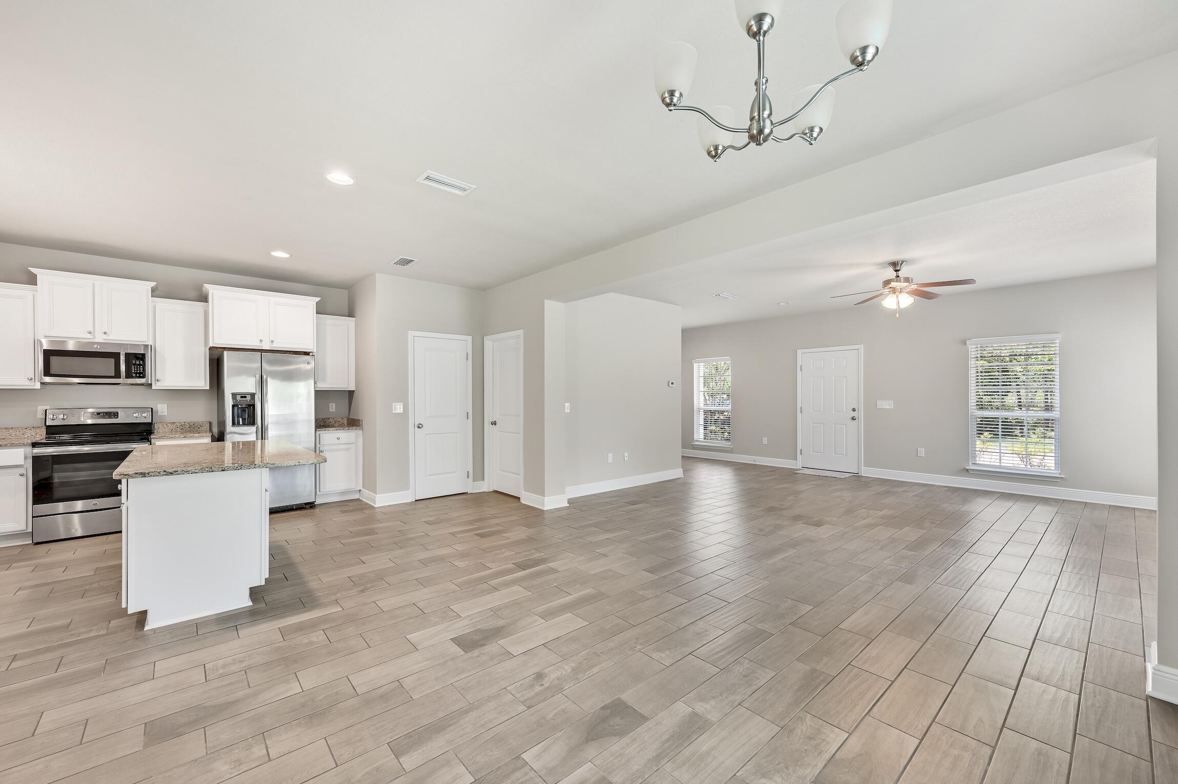 74 Tranquility Lane Santa Rosa Beach, FL 32459 - Photo 13 of 49 a view of kitchen with furniture and refrigerator