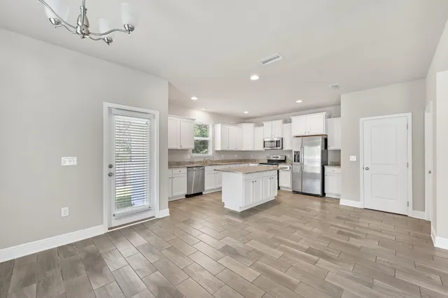 a view of kitchen with wooden floor