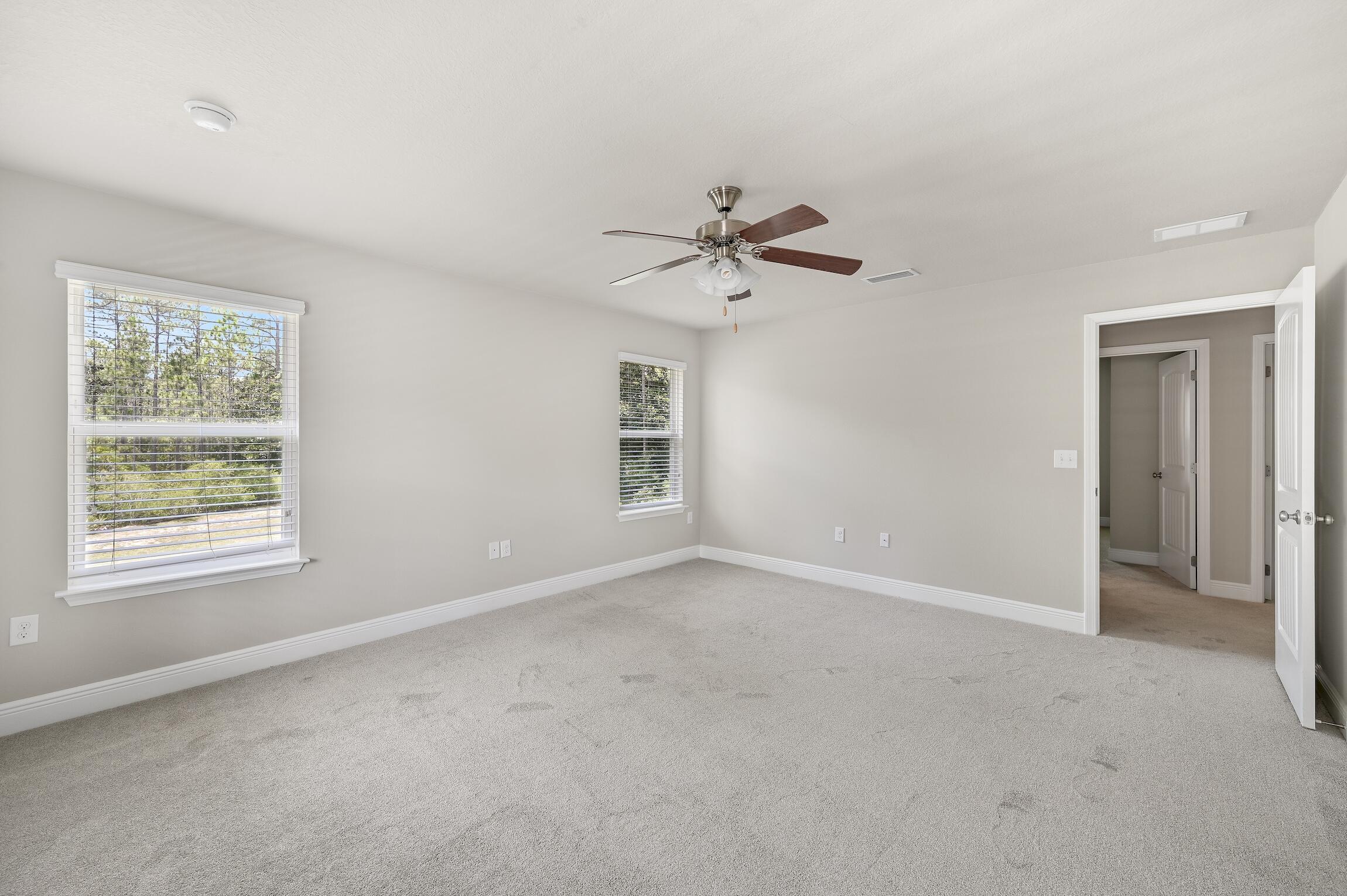 74 Tranquility Lane Santa Rosa Beach, FL 32459 - Photo 22 of 49 an empty room with a window and a fan