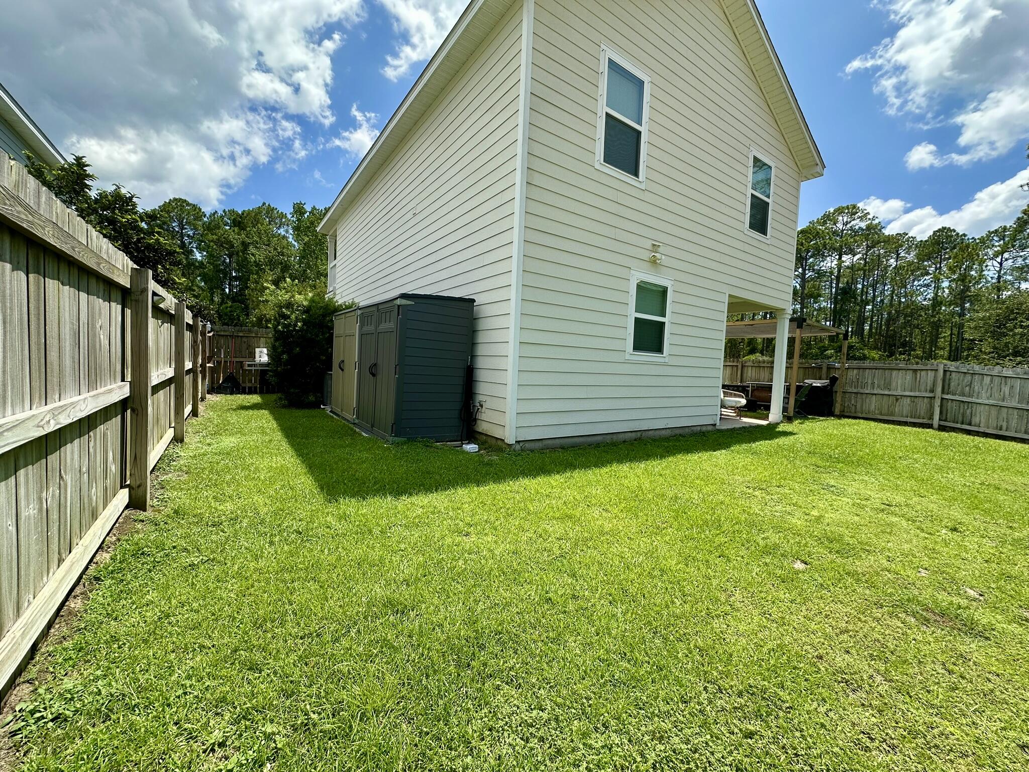 74 Tranquility Lane Santa Rosa Beach, FL 32459 - Photo 43 of 49 a view of a backyard with a garden
