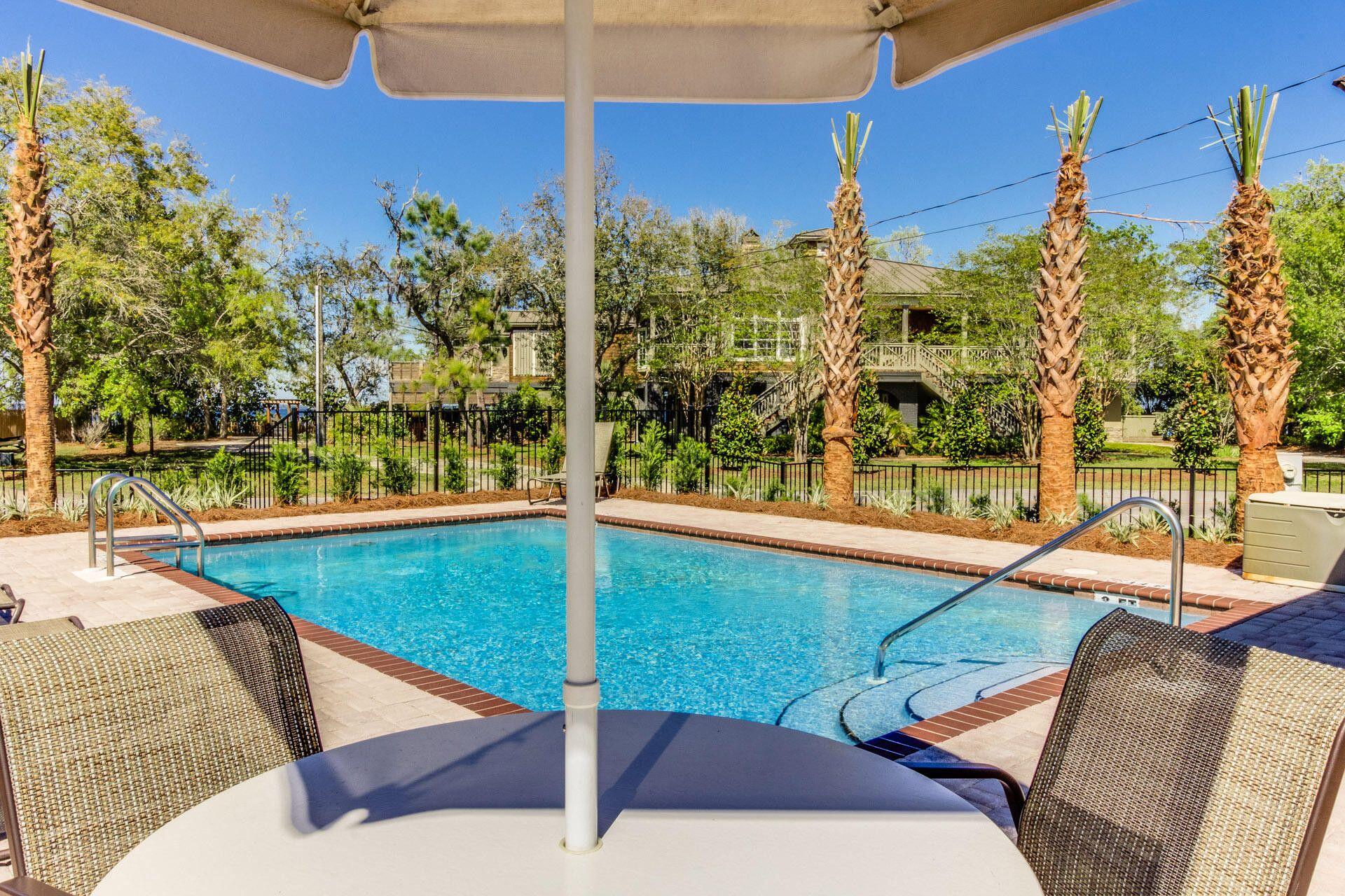 74 Tranquility Lane Santa Rosa Beach, FL 32459 - Photo 45 of 49 a view of a swimming pool with a patio