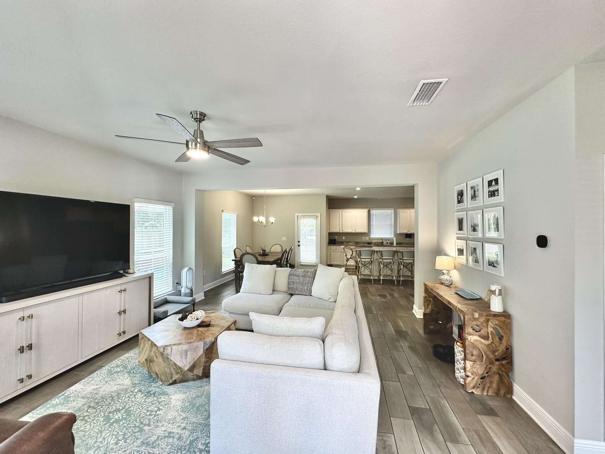 74 Tranquility Lane Santa Rosa Beach, FL 32459 - Photo 7 of 49 a living room with furniture and a flat screen tv