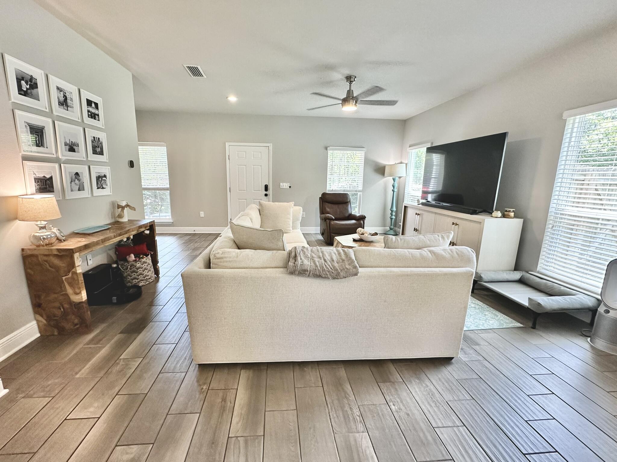 74 Tranquility Lane Santa Rosa Beach, FL 32459 - Photo 9 of 49 a living room with furniture and a flat screen tv