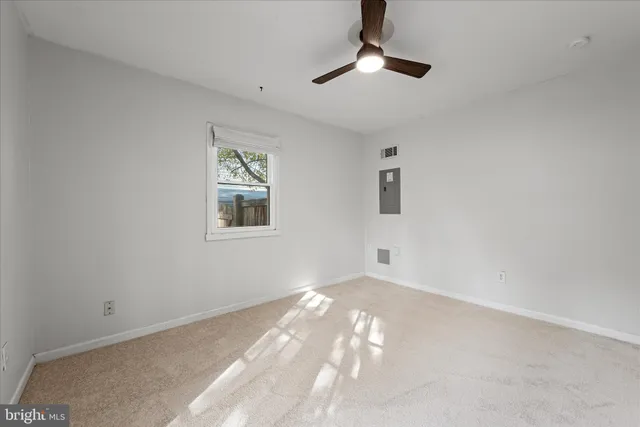 a view of an empty room and a window