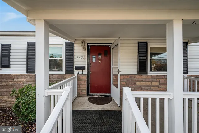 a front view of a house with stairs