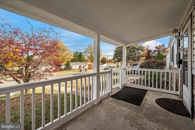 a view of a two chairs in the balcony
