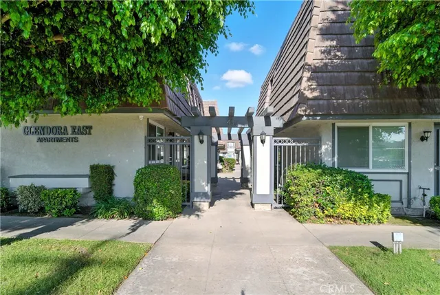 a front view of a building with garden