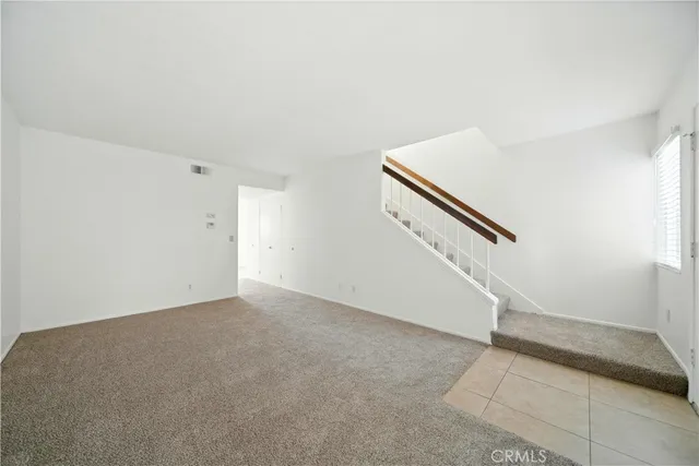 an empty room with staircase