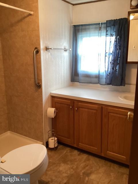 18 Spruce Drive Sicklerville, NJ 08081 - Photo 12 of 20 a bathroom with a sink a toilet and mirror