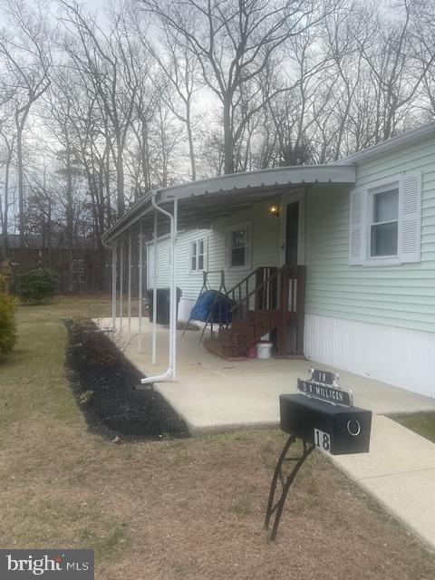 18 Spruce Drive Sicklerville, NJ 08081 - Photo 3 of 20 a backyard of a house with table and chairs