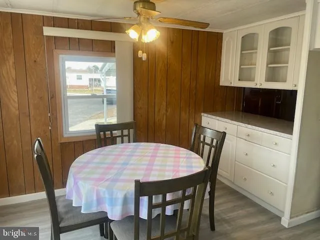 a view of a dining room with furniture and window