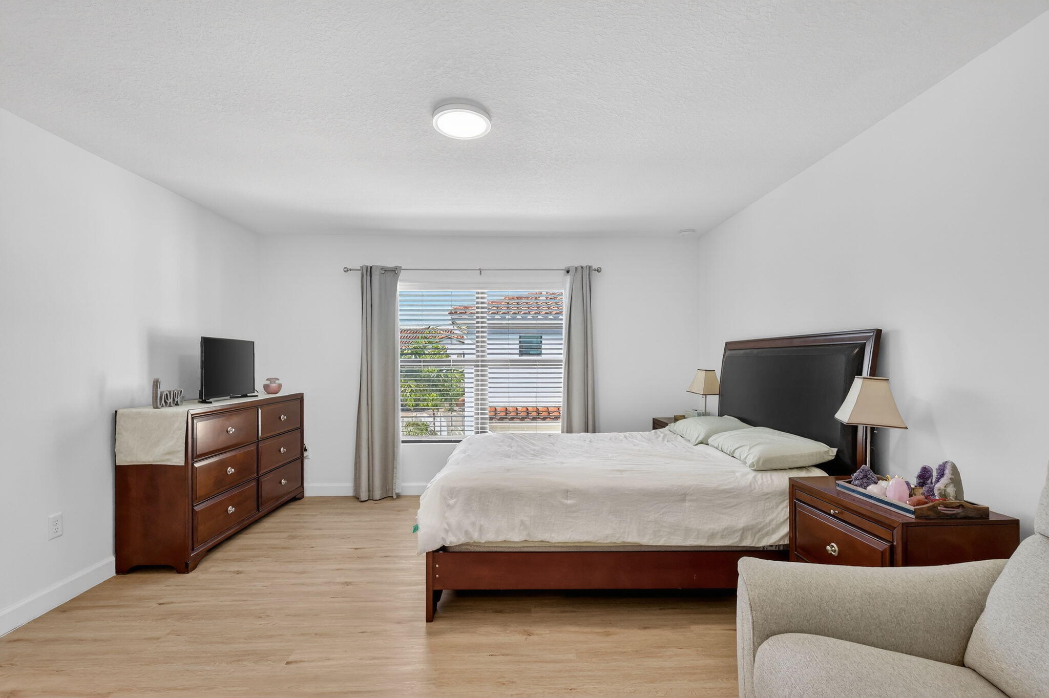 1011 Willow Place Riviera Beach, FL 33410 - Photo 21 of 65 a bedroom with a bed and a television