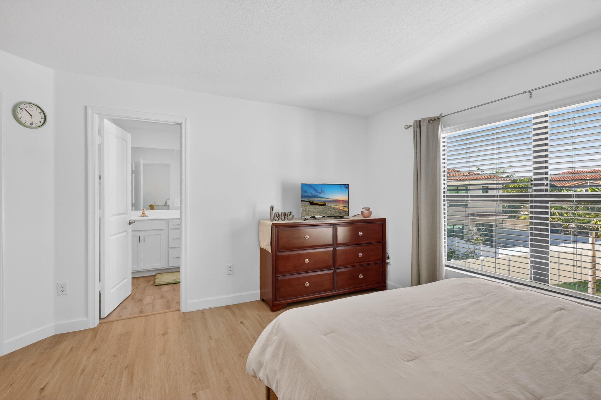 1011 Willow Place Riviera Beach, FL 33410 - Photo 23 of 65 a bedroom with a bed and a window