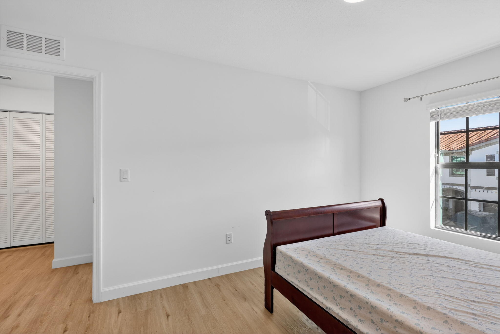 1011 Willow Place Riviera Beach, FL 33410 - Photo 28 of 65 a bedroom with a bed and wooden floor