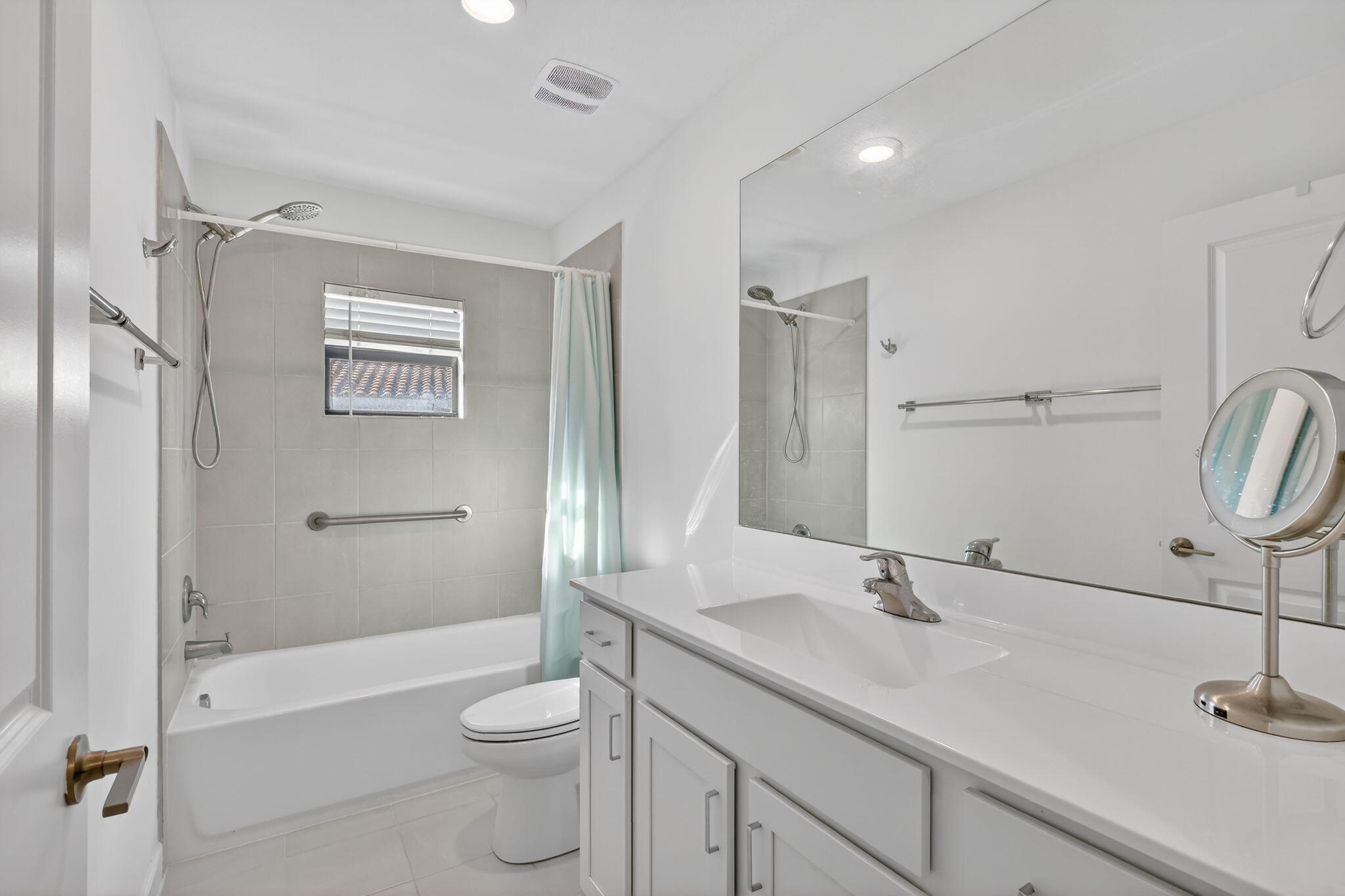 1011 Willow Place Riviera Beach, FL 33410 - Photo 31 of 65 a bathroom with a sink a toilet and shower