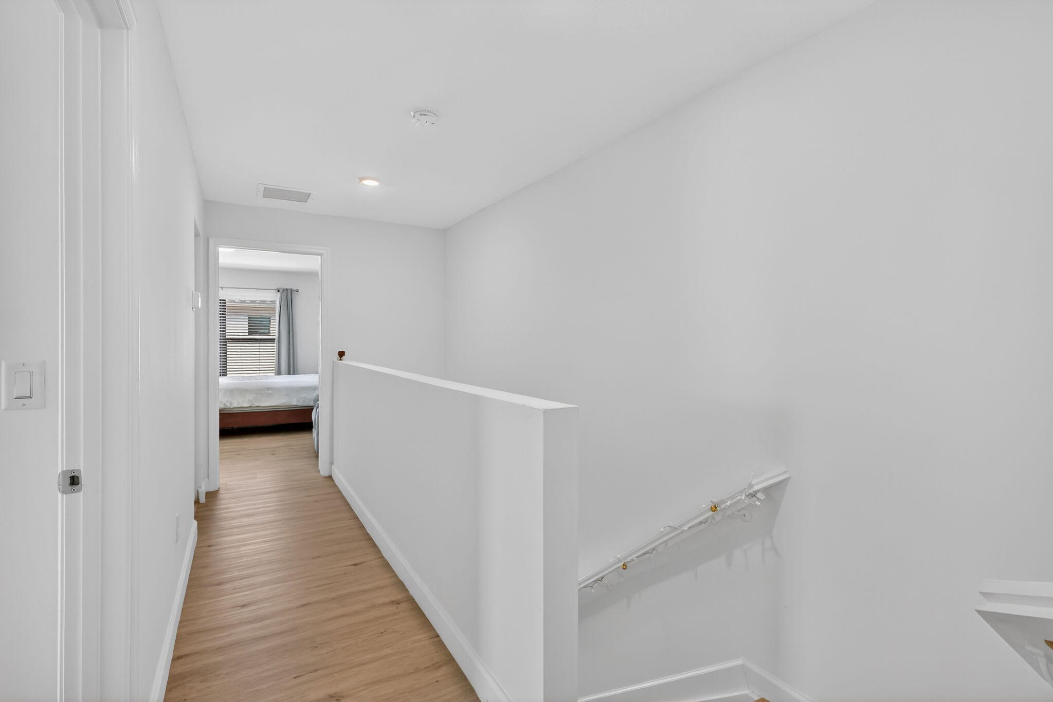 1011 Willow Place Riviera Beach, FL 33410 - Photo 33 of 65 a view of a hallway with wooden floor and staircase