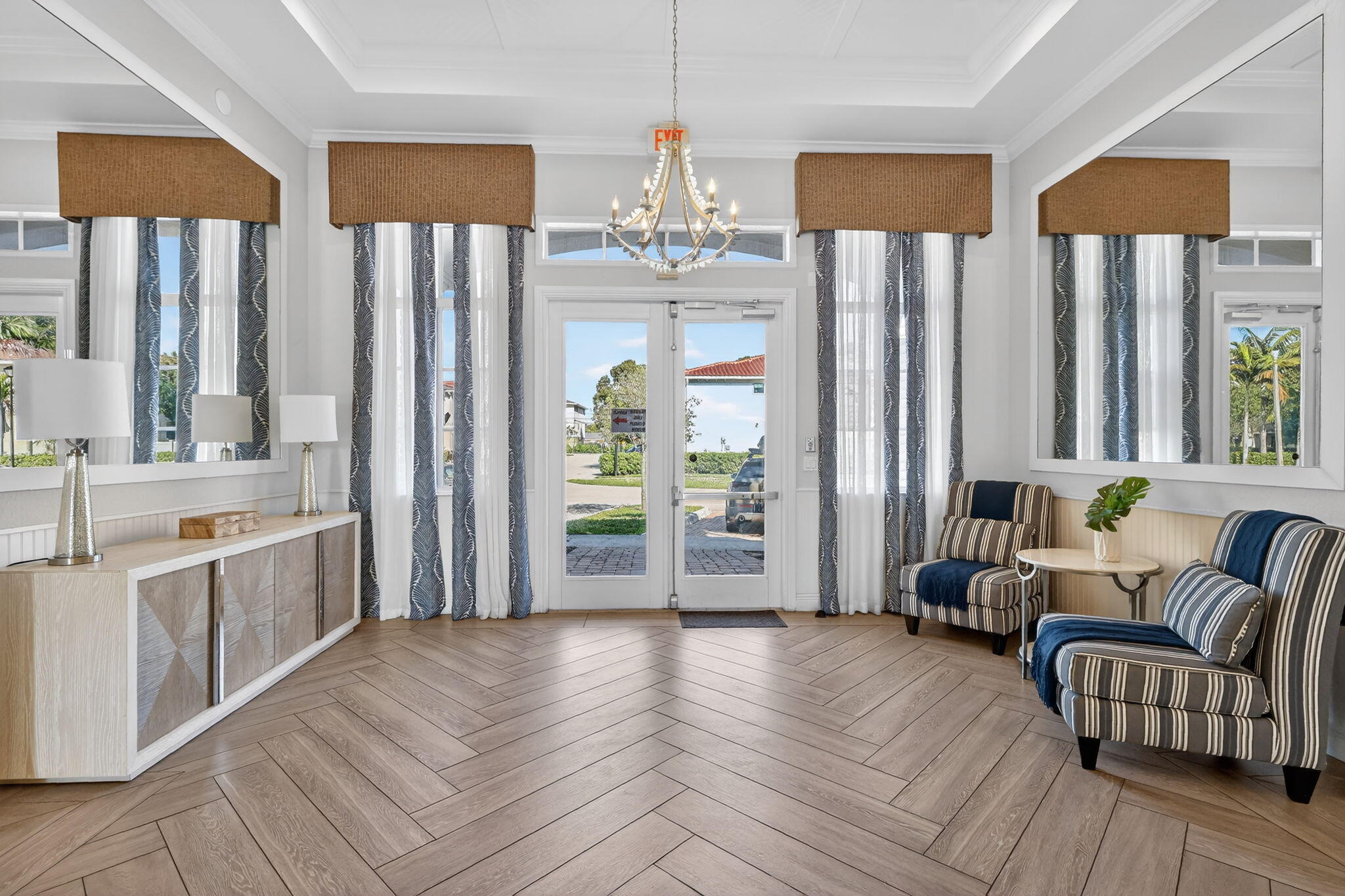 1011 Willow Place Riviera Beach, FL 33410 - Photo 40 of 65 a kitchen with stainless steel appliances granite countertop a refrigerator a sink dishwasher a dining table and chairs with wooden floor