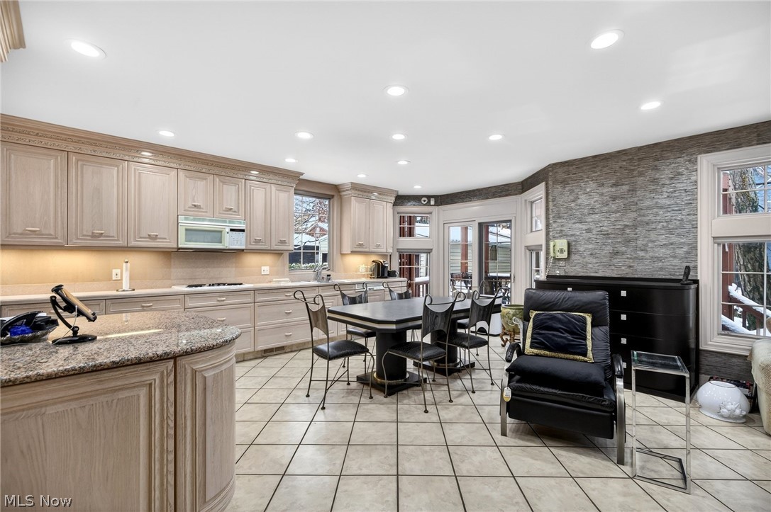 3498 Bainbridge Road Cleveland Heights, OH 44118 - Photo 49 of 50 Kitchen with white appliances, recessed lighting, light stone counters, light brown cabinetry, and open floor plan
