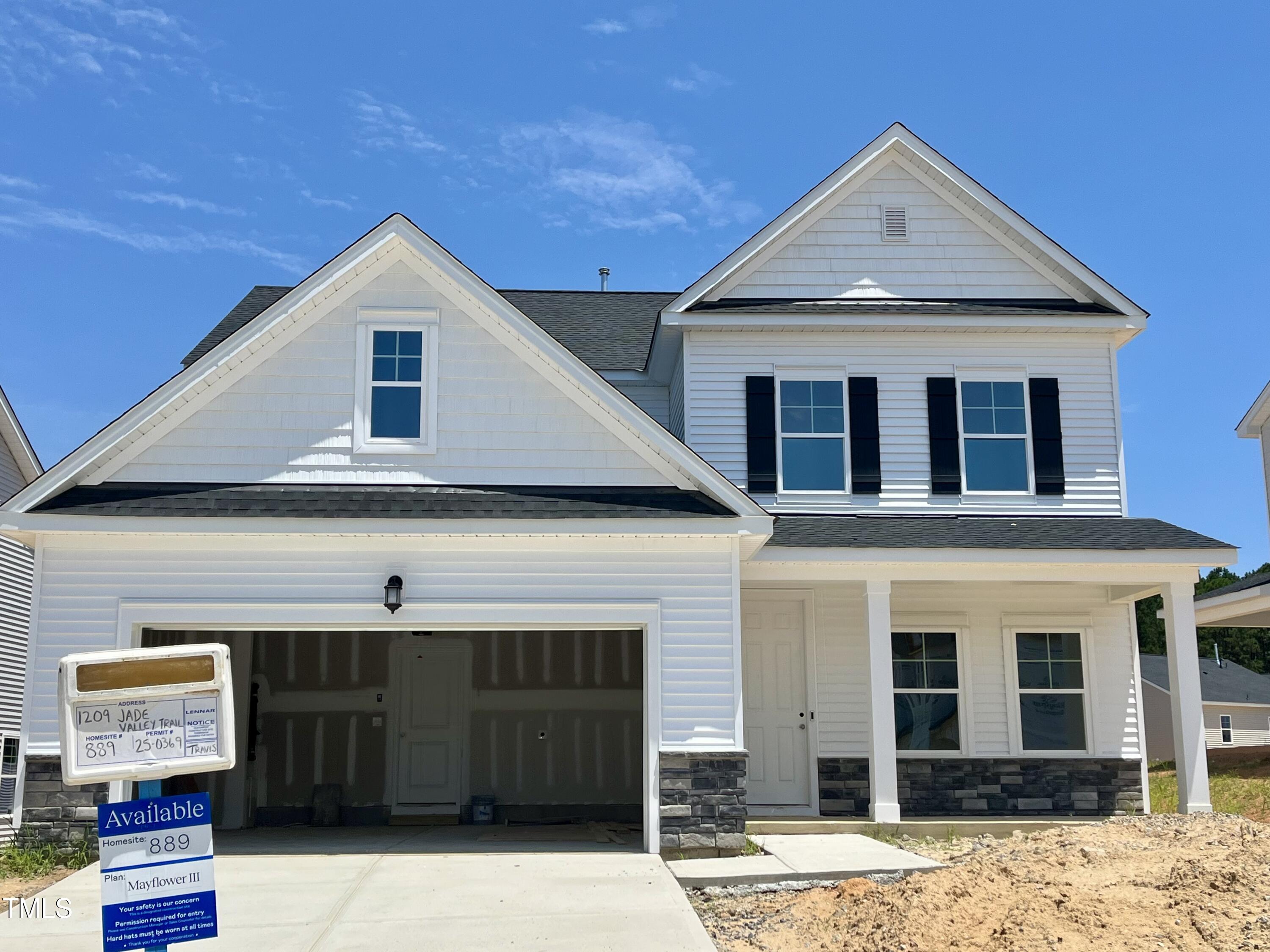 1209 Jade Vly Trail Raleigh, NC 27610 - Photo 1 of 23 a front view of a house with a yard