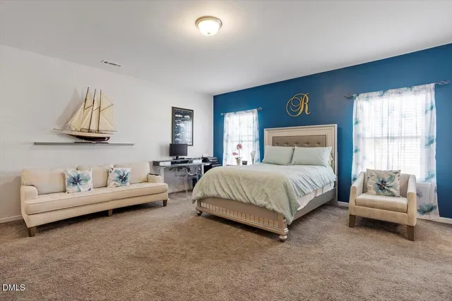 a bedroom with a bed and furniture