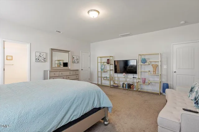 a bedroom with bed and window