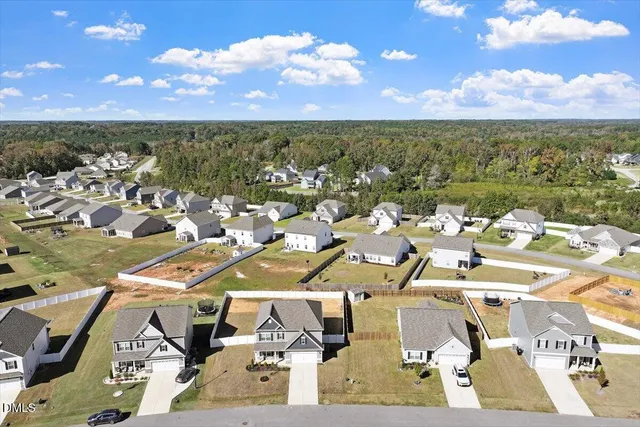 an aerial view of a house with swimming pool
