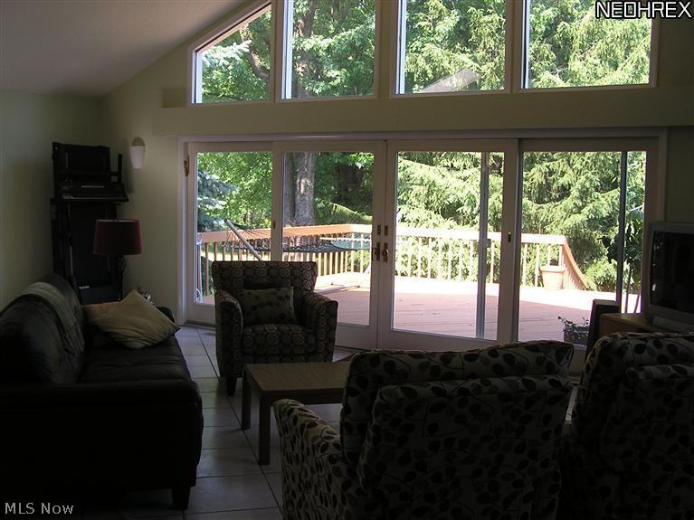 2859 Brainard Road Cleveland, OH 44124 - Photo 14 of 25 Family room has a vaulted ceiling and a wall of windows - opens onto the deck.