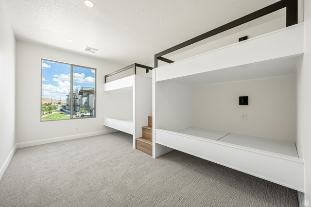 684 West High Tide Place, Unit 131 St. George, UT 84790 - Photo 11 of 27 Built-in bunk beds with integrated wood-finish stairs provide efficient sleeping arrangements