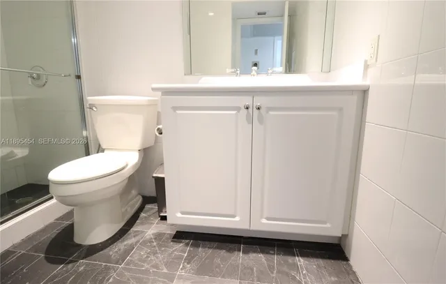 a bathroom with a toilet and a sink