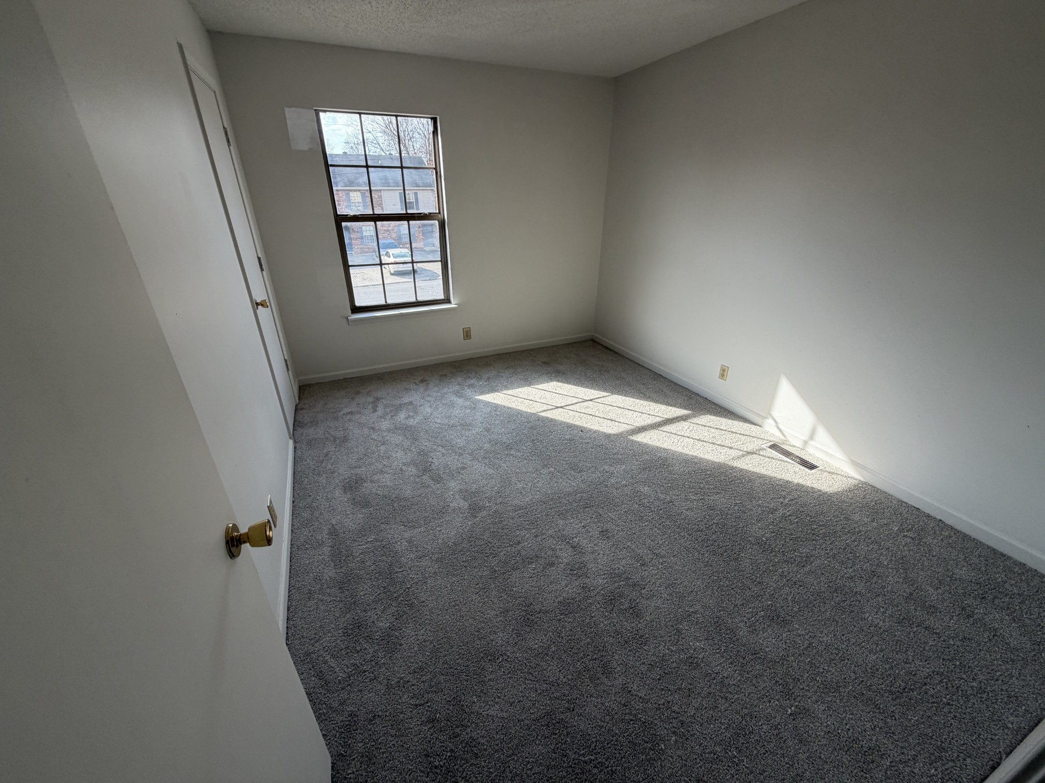 103 Hickory Trace Road, Unit 2 Clarksville, TN 37040 - Photo 6 of 7 an empty room with windows