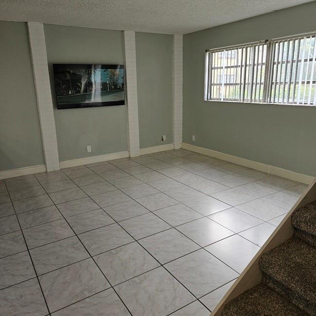 3270 North Pine Island Road, Unit 307 Sunrise, FL 33351 - Photo 13 of 17 a view of an empty room and window
