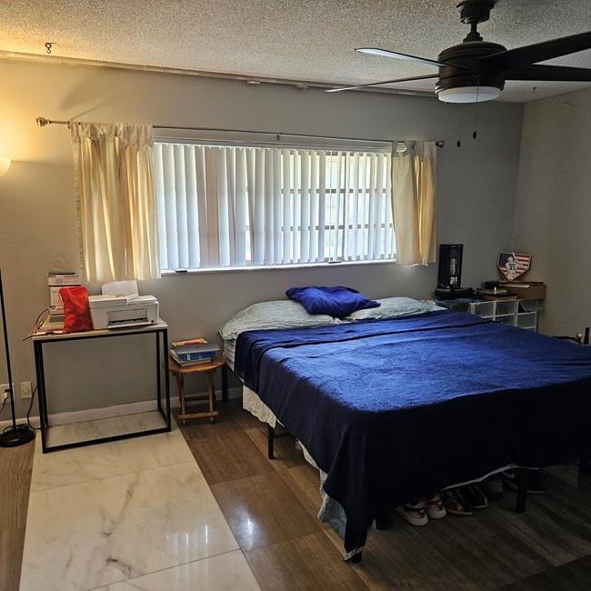 3270 North Pine Island Road, Unit 307 Sunrise, FL 33351 - Photo 16 of 17 a bedroom with a bed and a window